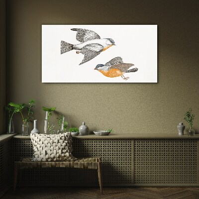 Birds in flight Glass Print