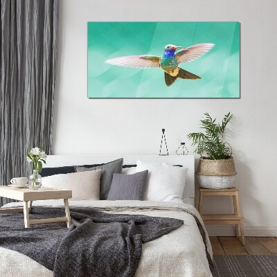 Hummingbird in blue background Glass Wall Art