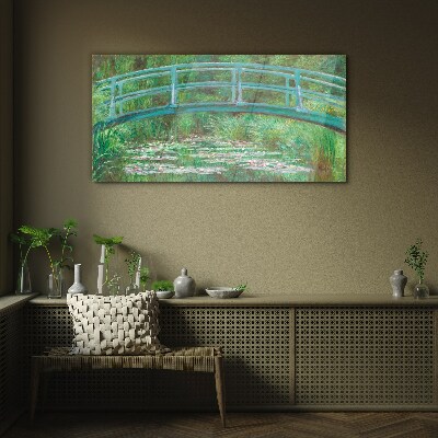 A bridge over the pond Glass Print