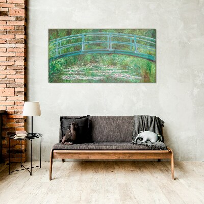 A bridge over the pond Glass Print