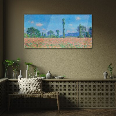 Flower field under blue sky Glass Print