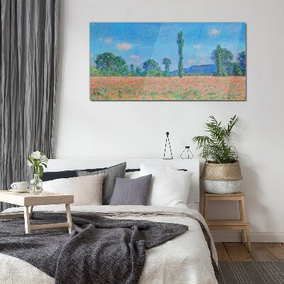 Flower field under blue sky Glass Print