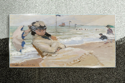 Woman on the beach with an umbrella Glass Print