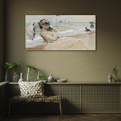 Woman on the beach with an umbrella Glass Print