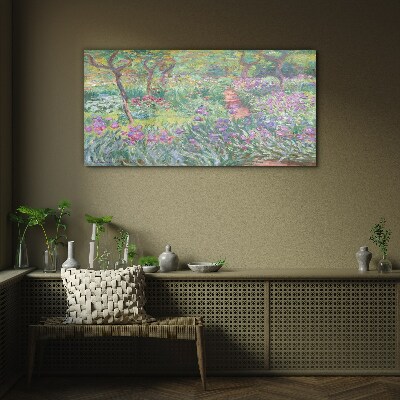 Flower garden in the spring sun Glass Print