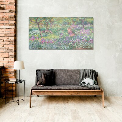 Flower garden in the spring sun Glass Print
