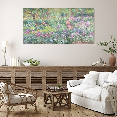 Flower garden in the spring sun Glass Print