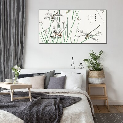 Slender dragonflies in green surroundings Glass Print