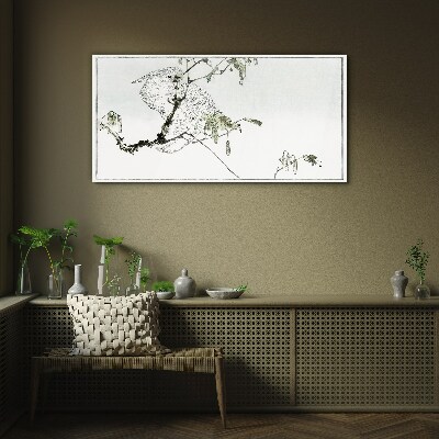 Bird on a branch Glass Print