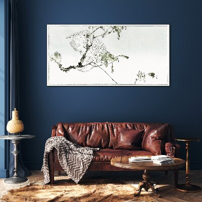 Bird on a branch Glass Print