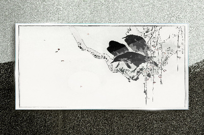 Black birds on a branch Glass Print