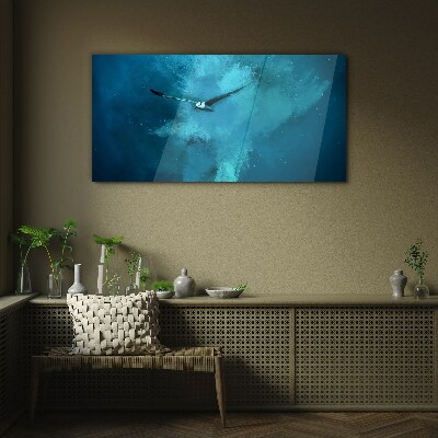 A bird in the blue space Glass Wall Art