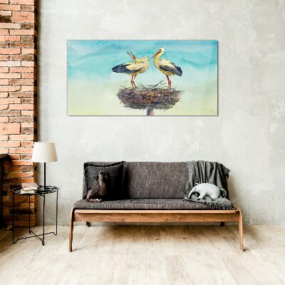 Storks on a nest in the blue Glass Wall Art