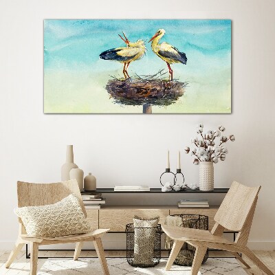 Storks on a nest in the blue Glass Wall Art