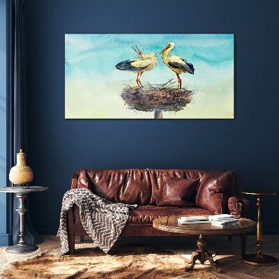 Storks on a nest in the blue Glass Wall Art
