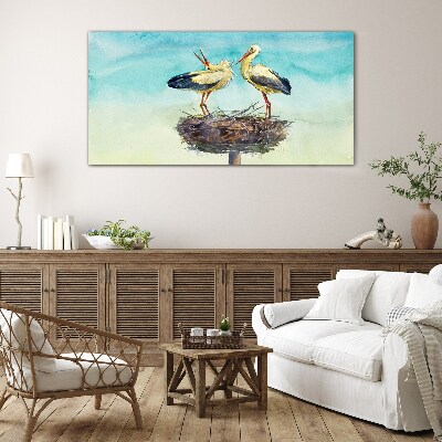 Storks on a nest in the blue Glass Wall Art