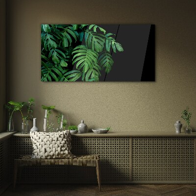 Green leaves on a black background Glass Wall Art