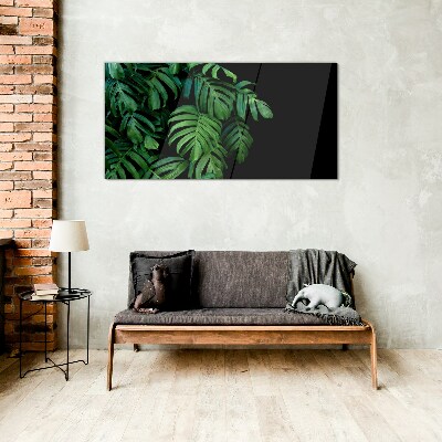 Green leaves on a black background Glass Wall Art