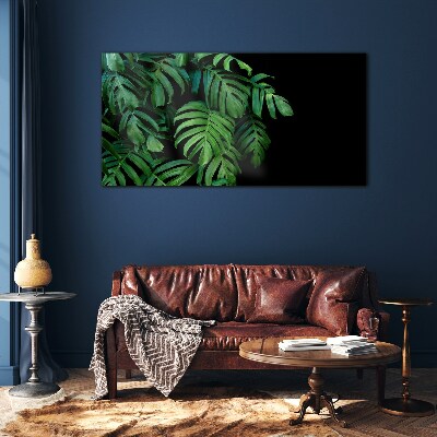Green leaves on a black background Glass Wall Art