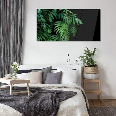 Green leaves on a black background Glass Wall Art
