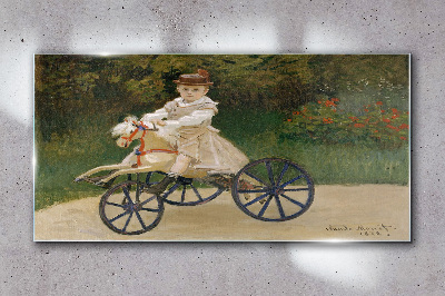 Child on a ride-on Glass Wall Art
