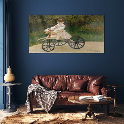 Child on a ride-on Glass Wall Art