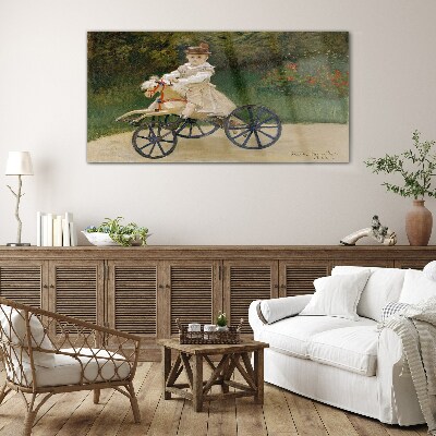 Child on a ride-on Glass Wall Art