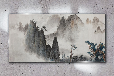 Mountain landscape in a misty landscape Glass Wall Art
