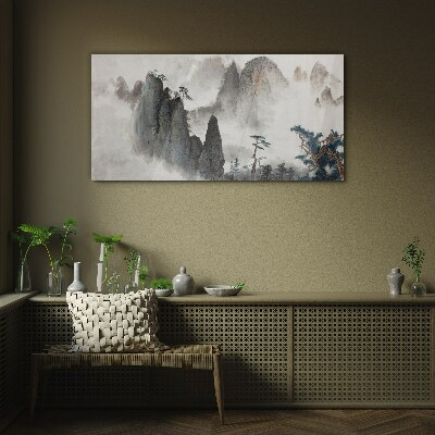 Mountain landscape in a misty landscape Glass Wall Art