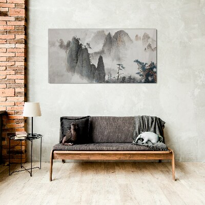 Mountain landscape in a misty landscape Glass Wall Art