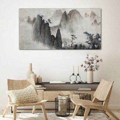 Mountain landscape in a misty landscape Glass Wall Art