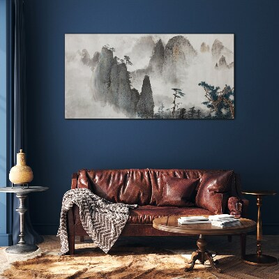 Mountain landscape in a misty landscape Glass Wall Art