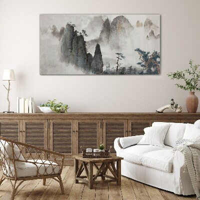 Mountain landscape in a misty landscape Glass Wall Art