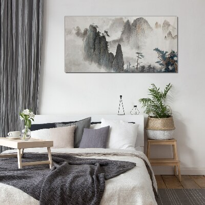 Mountain landscape in a misty landscape Glass Wall Art