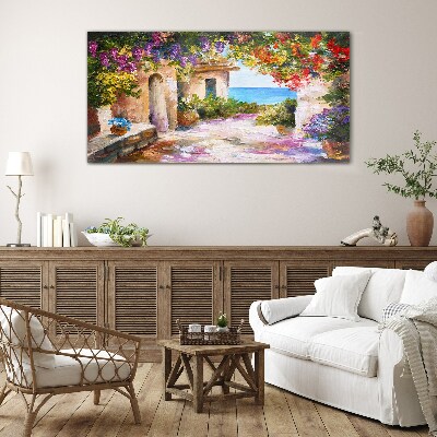 The flower alley of a seaside village Glass Wall Art