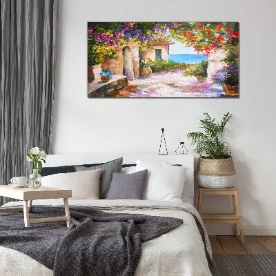 The flower alley of a seaside village Glass Wall Art