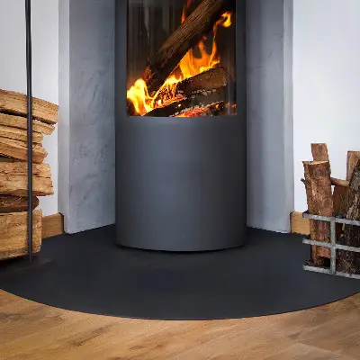 Quarter-round black steel spark guard floor plate