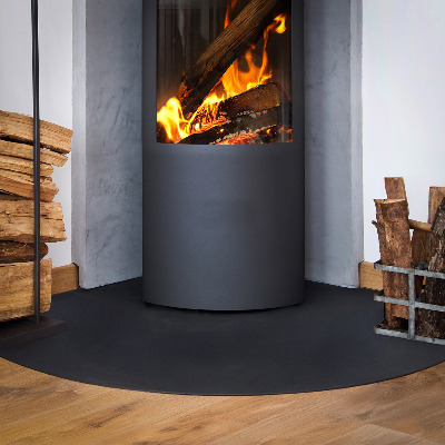 Spark guard floor plate in a quarter-round shape made from black steel