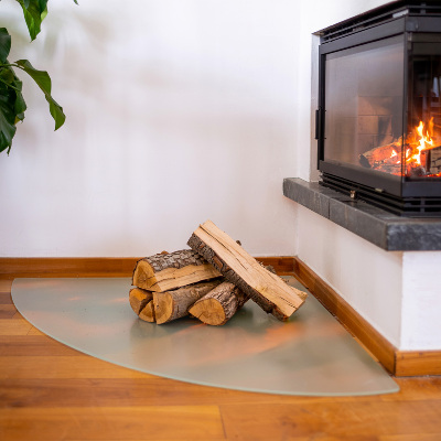 Quarter-circle translucent fireplace hearth pad