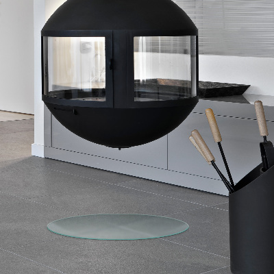 Circular translucent glass fireplace hearth pad