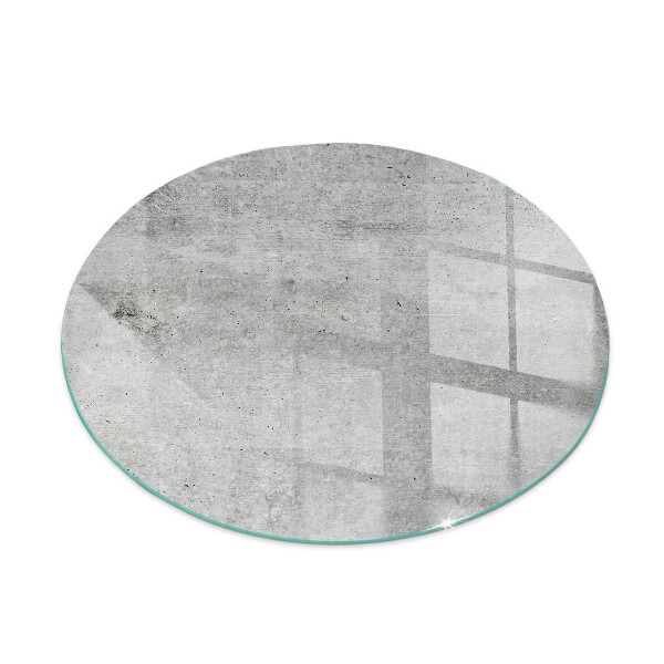 Glass hearth for stove round Raw concrete texture