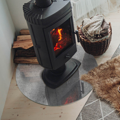 Glass hearth for stove round Raw concrete texture