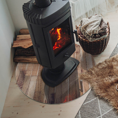 Glass hearth for stove round Wooden board in arrangement