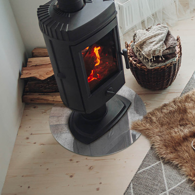 Glass hearth for stove round Raw concrete texture