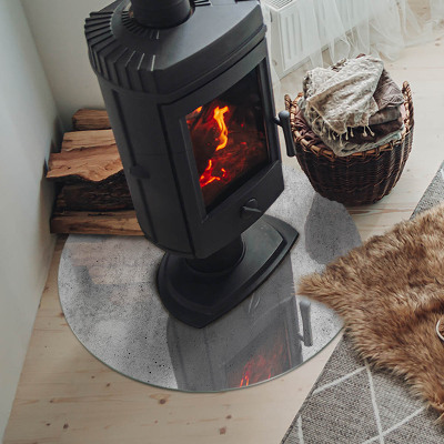 Glass hearth for stove round Raw concrete texture