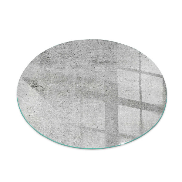 Glass hearth for stove round Raw concrete texture