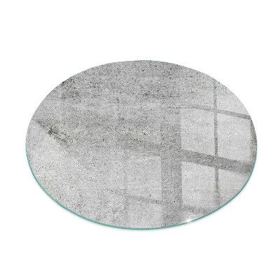 Glass hearth for stove round Raw concrete texture