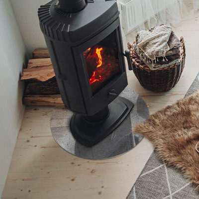 Glass hearth for stove round Raw concrete texture