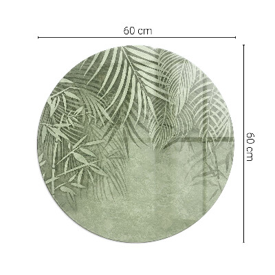 Glass hearth pad round Tropical leaves in the background