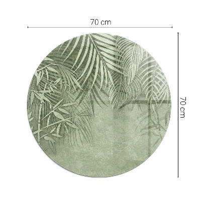 Glass hearth pad round Tropical leaves in the background